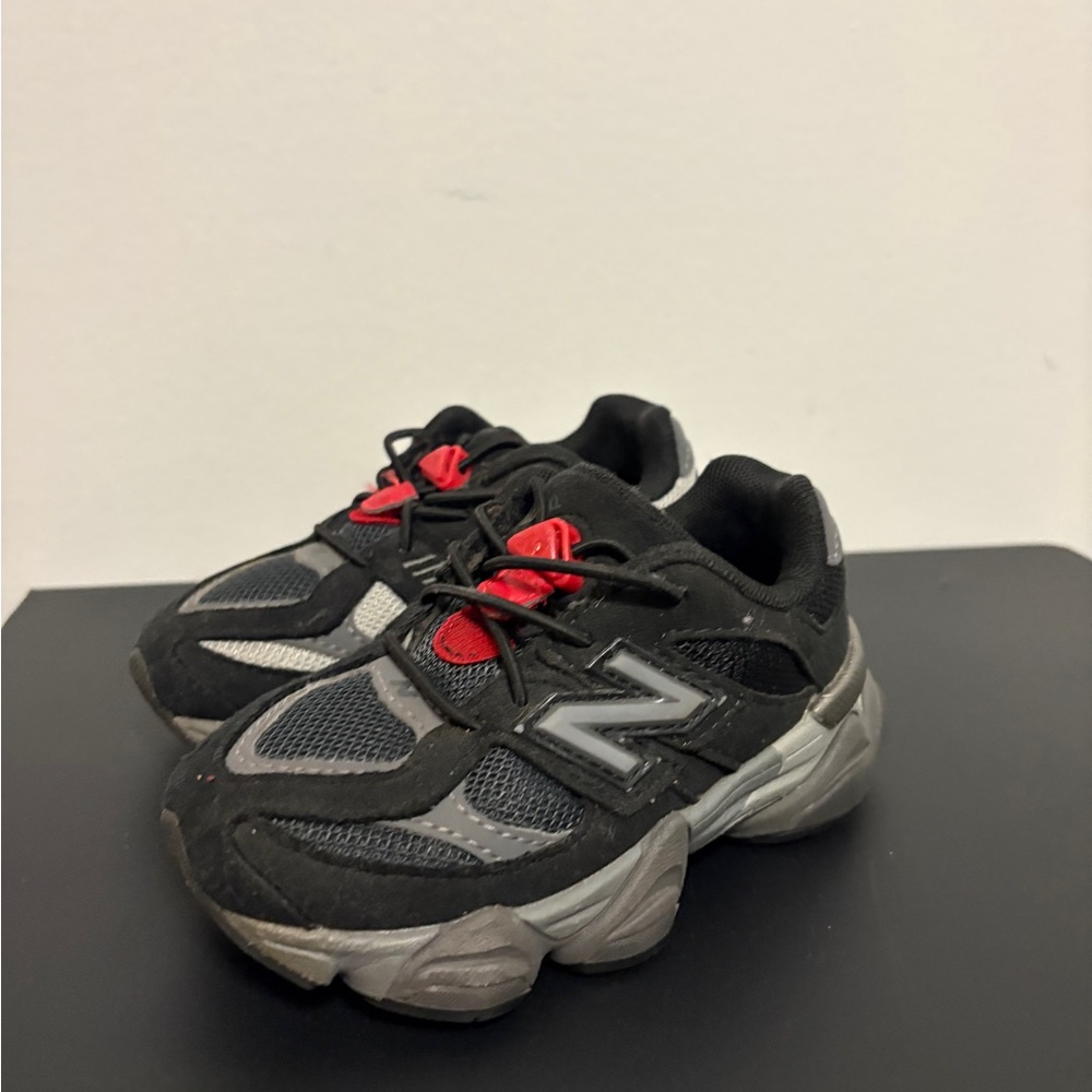 New Balance Kids Black and Gray Sneakers with Red Accents